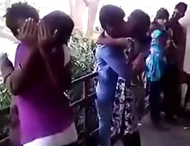 College students exchange tender kisses at a famous love spot