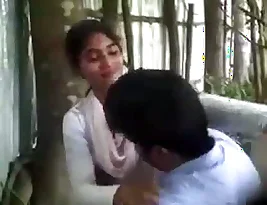 Secret camera records a college girl’s naughty antics outside.