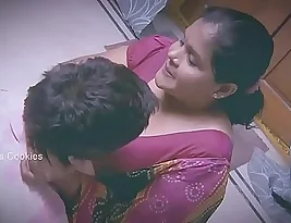 A slightly heavier Indian woman and a younger man.