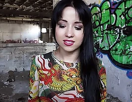 A brightly dressed Russian woman gives a blow job in a rather exposed location.