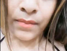 Beautiful Indian woman exposing her breasts and stroking her vagina