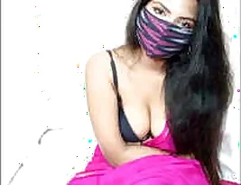 Beautiful girl showing her big natural tits and being very horny indeed.