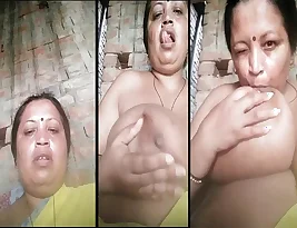 A mature widow from India exposes her large natural breasts and even sucks them.