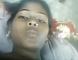Young Indian woman exposing her breasts and vagina