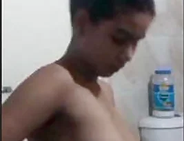 A short video of an Indian woman in the bathroom.