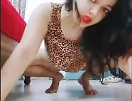 Medium shot of the sexy bhabi stripping and dancing.