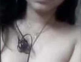 A beautiful Indian girl performing for the camera during a video call.
