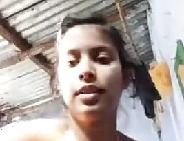 Partly dressed Indian girl takes sexy photos and shares them.