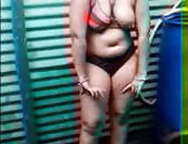My older woman Bhabhi was caught in the shower in the nude.