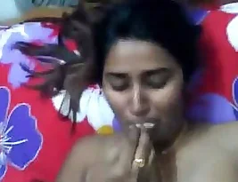Beautiful Indian girl undressing for a selfie.