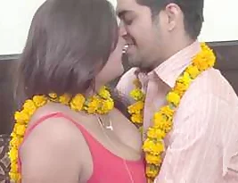 A mature and attractive woman engaged in a sexual affair with her young lover which includes kissing and groping of her breasts.