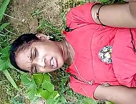 A village girl from the Indian subcontinent having sex outside.