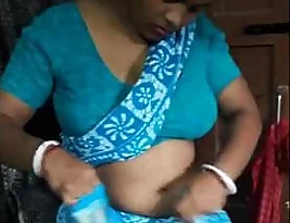 Disa Roy, the bubbly housewife from Delhi, shows off her charms in a blue saree.