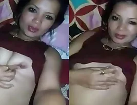 Women with large breast finger her vagina while alone.