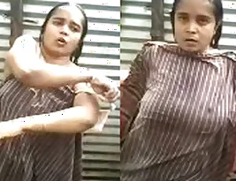 Desi MILF bathing outside in the hot weather.