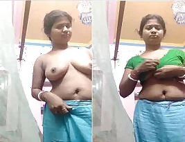 An Indian housewife removes her saree to reveal her body.