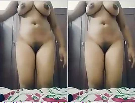 An Indian girl strips and takes sexy photos and movies for the first time.