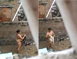 Hidden camera film of big ass of a mature beautiful desi bhabhi while taking a bath outside.