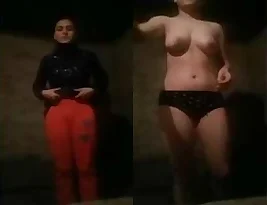 A beautiful woman from the Indian subcontinent starts to undress, revealing her breasts and vagina in the first part.