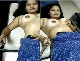 A beautiful Tamil woman shares her large breasts and vagina.