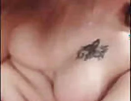 Pretty woman exposing her breasts and vagina
