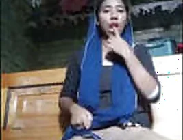 An Indian girl masturbates with a condom on her finger.