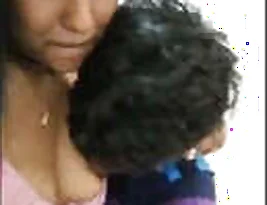 A beautiful Indian woman from a traditional background exposes her breasts while giving a blow job to a loved one.