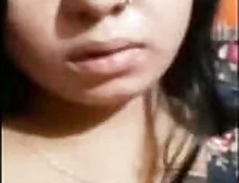 A beautiful Indian woman showing her breasts on a video call.