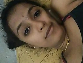 A woman from a family back in India exposes her breasts.